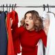 woman looking through clothes on a rail. Blog Post How to Look Stylish Everyday on a Budget.