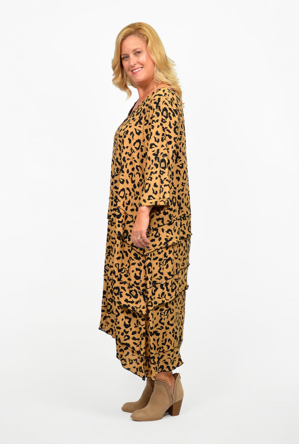 Blond woman wearing an animal print maxi dress, illustrating a point in the blog post How to Wear a Maxi Dress if you are Short and Curvy.