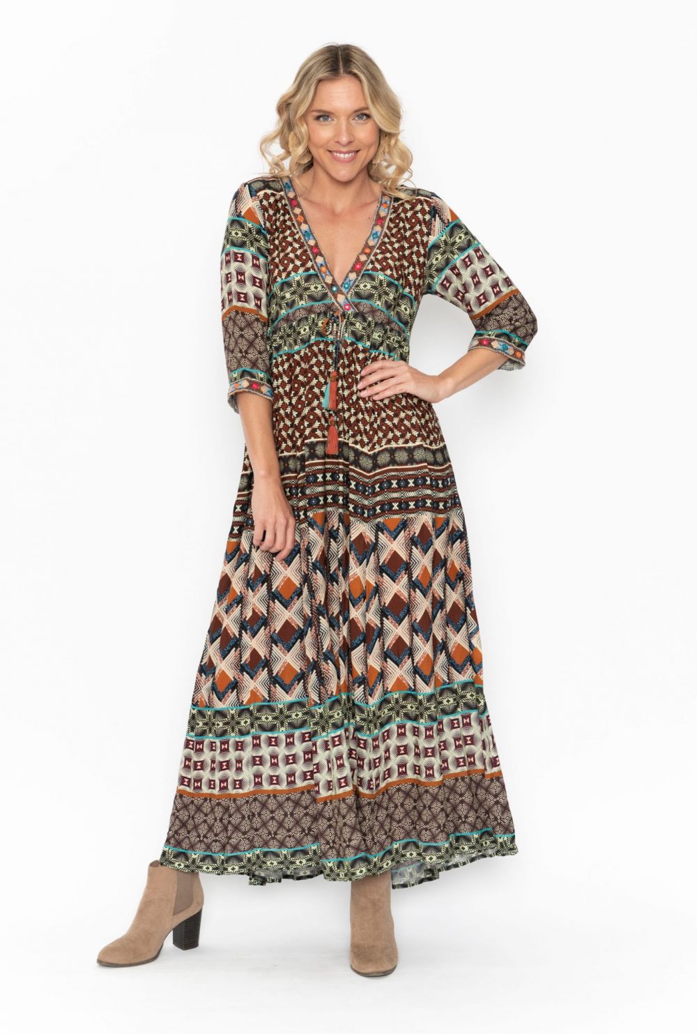 Blond woman wearing a paisley maxi dress