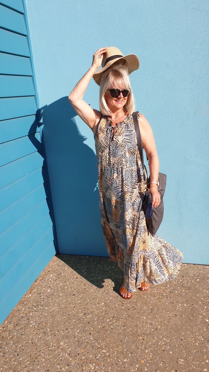 Woman wearing an animal print maxi dress