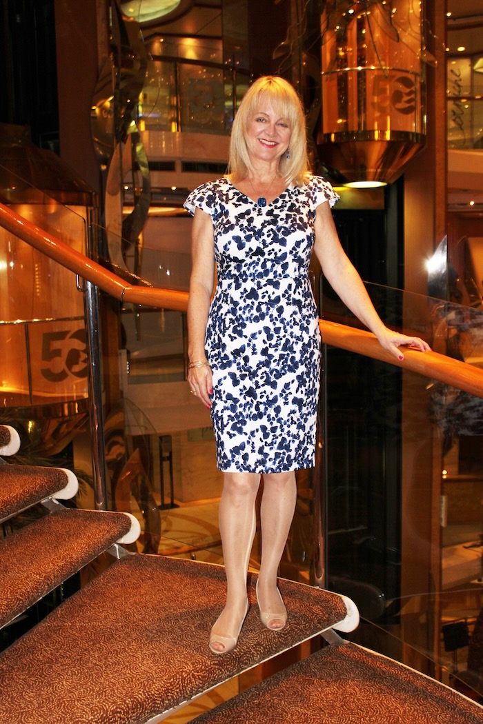 Woman wearing a blue and white dress in the blog post best dresses for women over 50