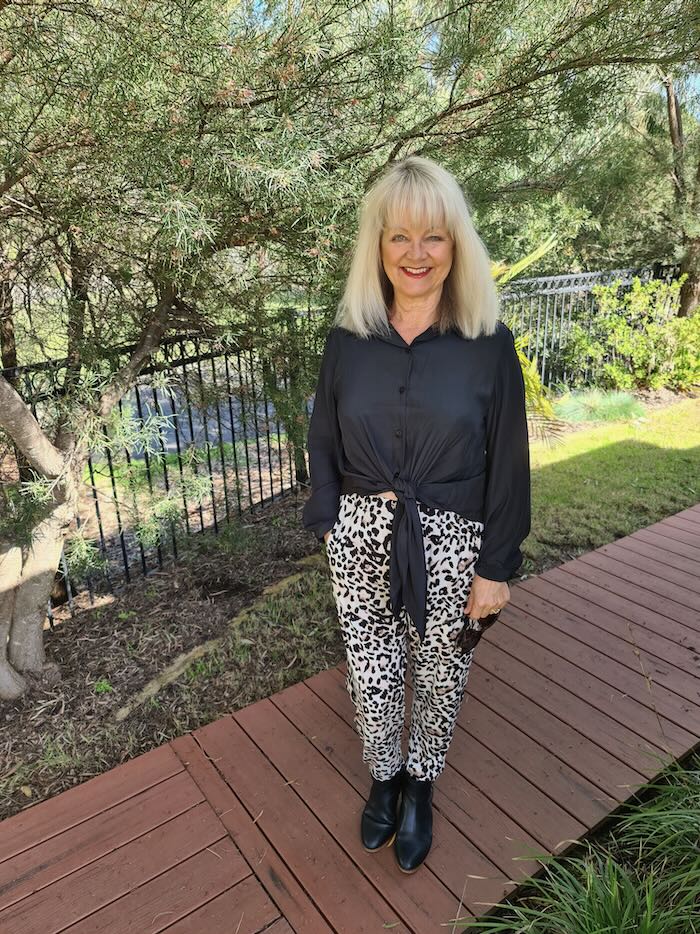 Middle-aged Blonde Woman, Wearing Green Leggings and White Top