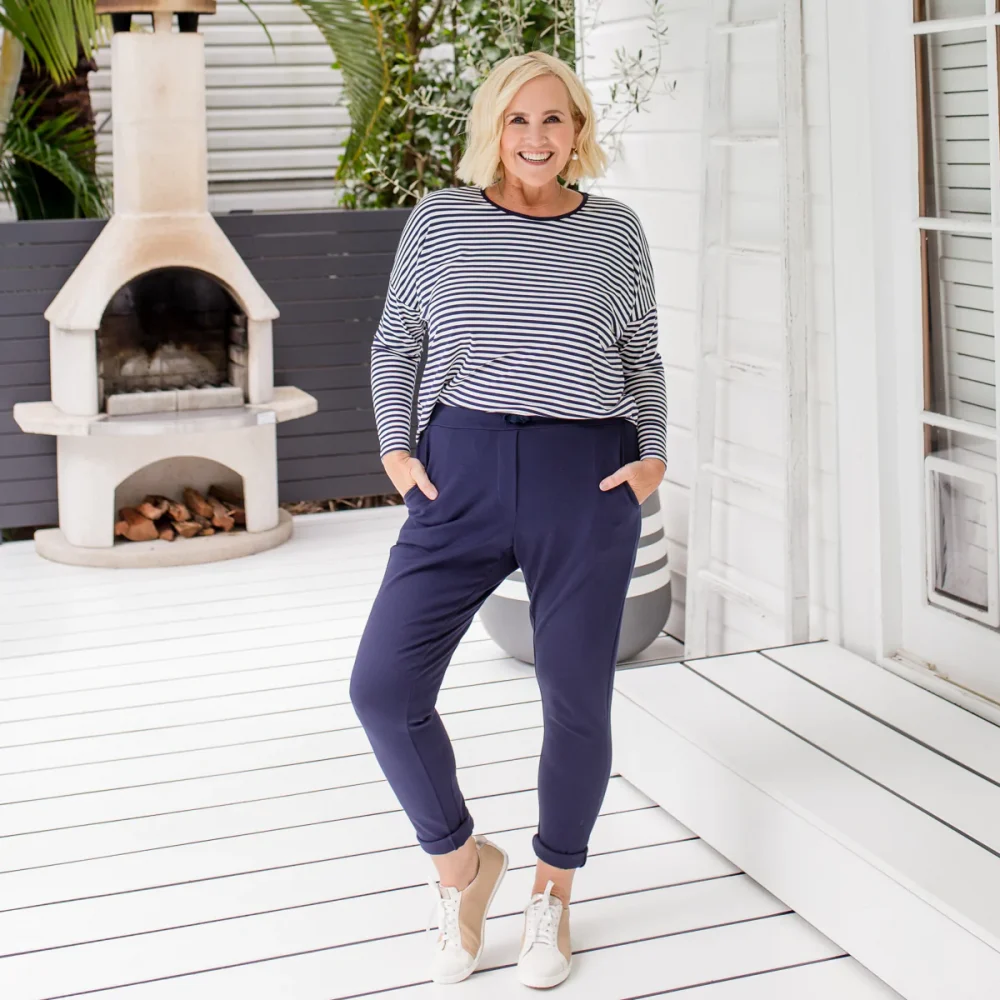 Nikki from Styling You The Label wearing a stylish, striped relaxed Tee and joggy pants in the blog post about sensational clothes for women over 50 years old.