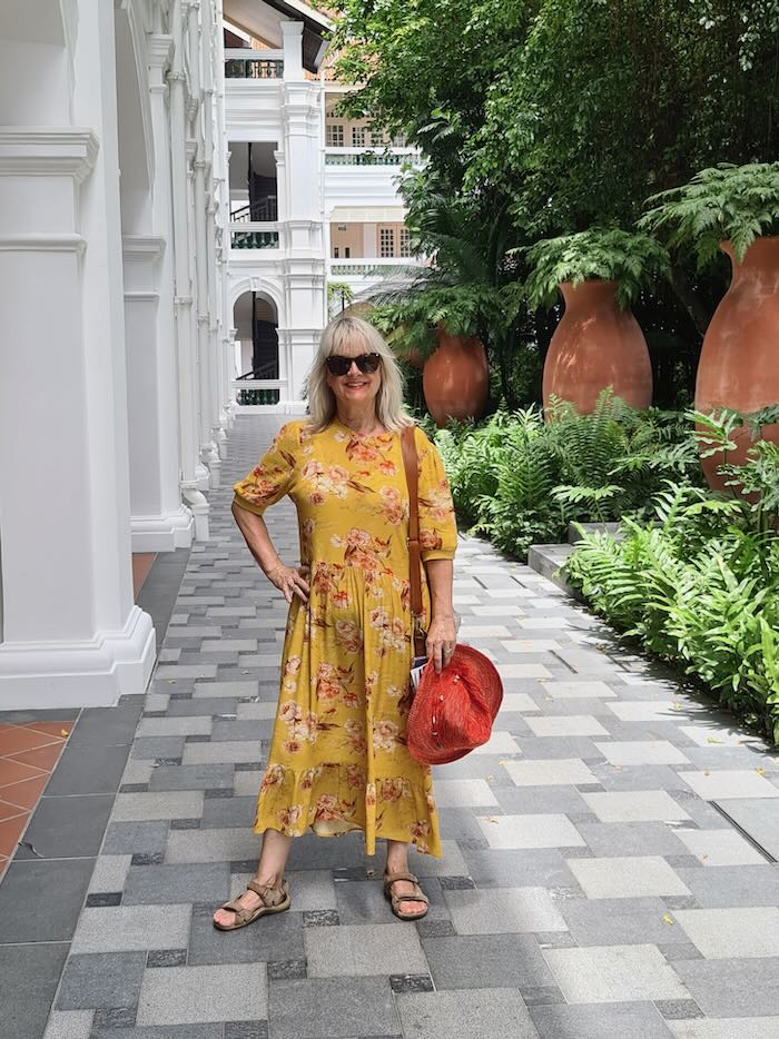 Woman wearing a floral boho style dress, illustrating the point, what are boho prints.