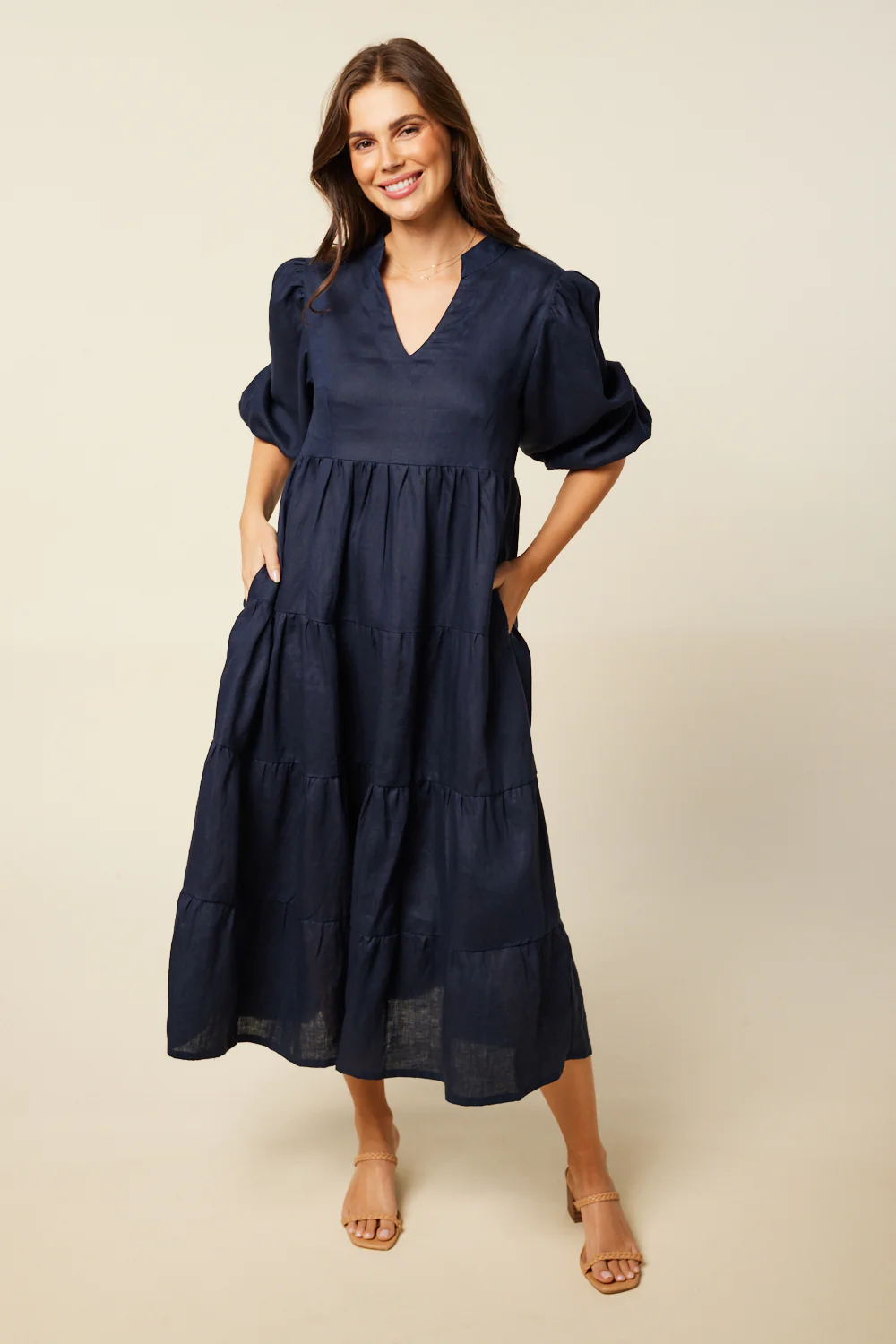 Woman in navy blue A Line style dress.