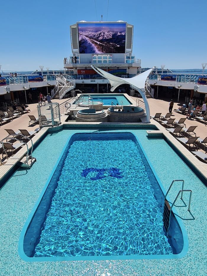 An image showing the pool deck on the Discovery Princess, a cruise ship that sails for Princess Cruises in Alaska.