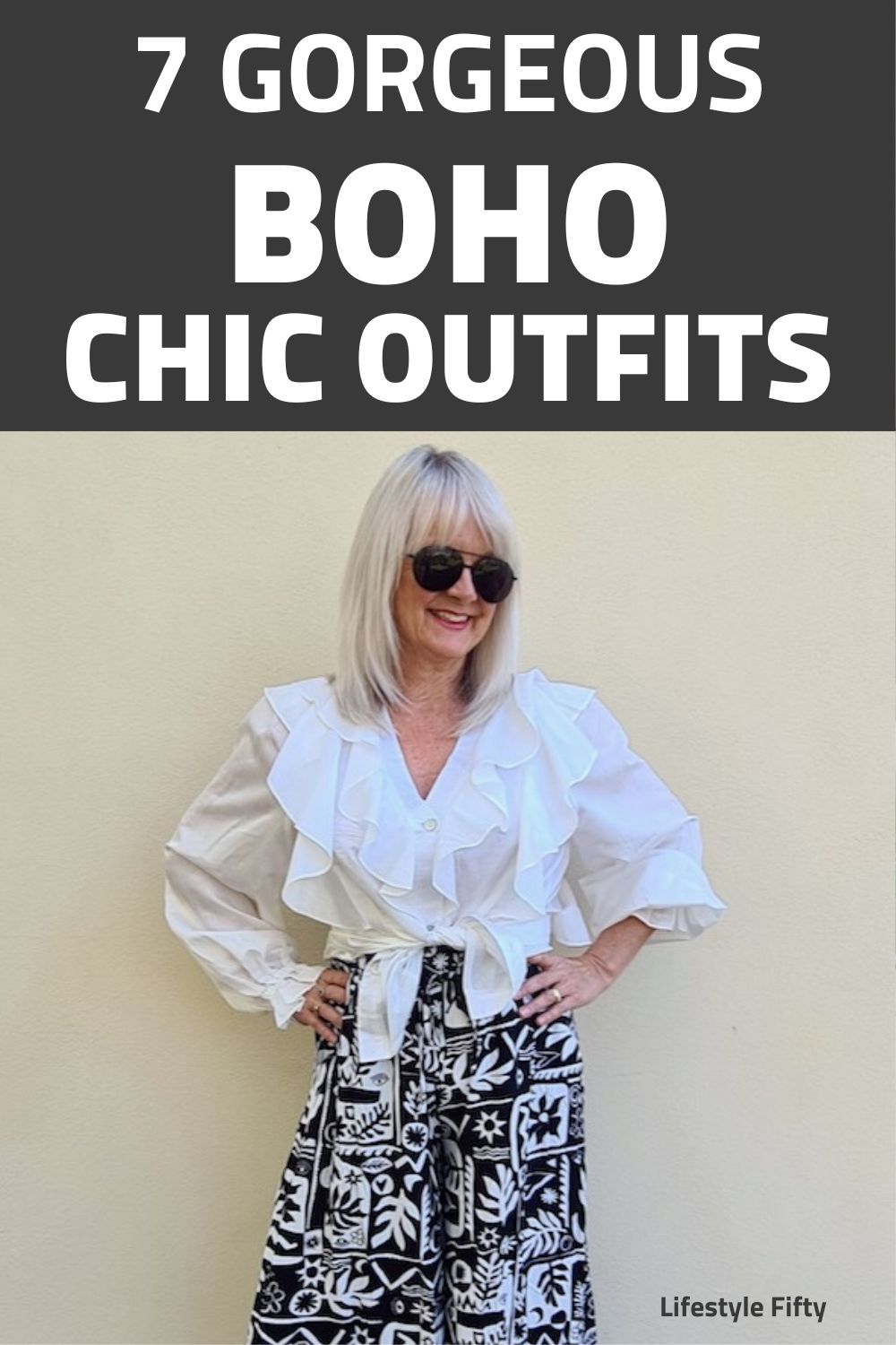 Blond woman wearing boho chic outfit. White frilly blouse and vintage floral wide leg pants.