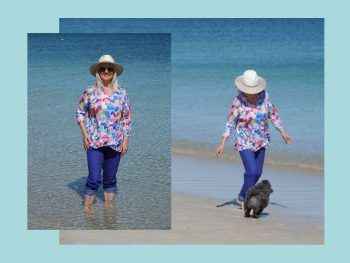 Fashion styles. Woman walking on beach wearing colorful clothes.