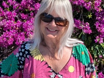 Woman in a summer dress illustrating what to pack for south of France in May.