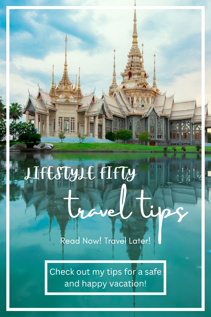 travel image with water in foreground, and historic temple
